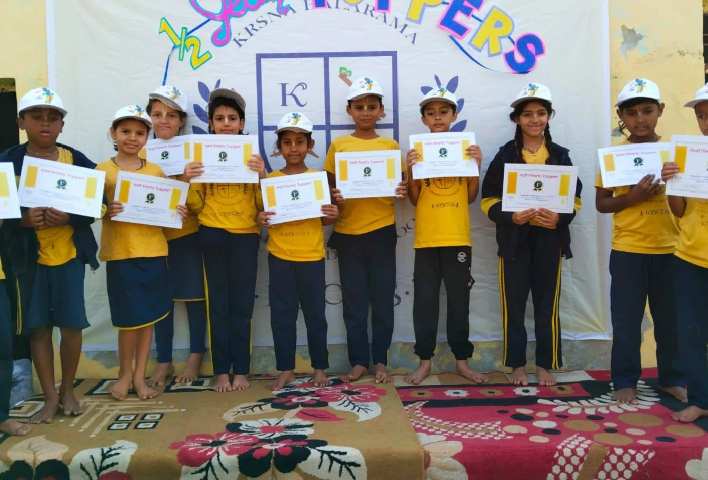 KBCDS students receiving achievement certificates